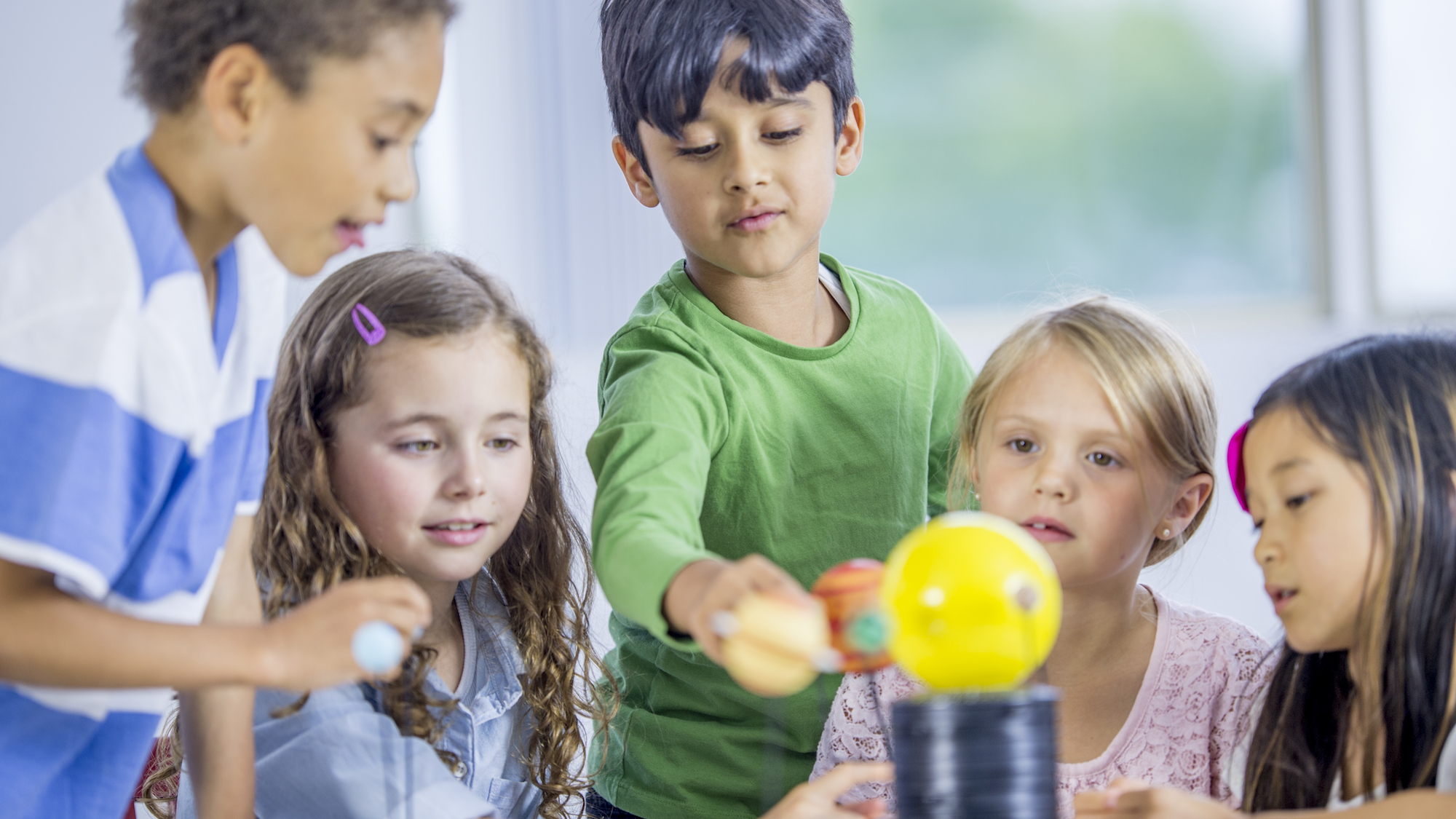 Children exploring a model solar system